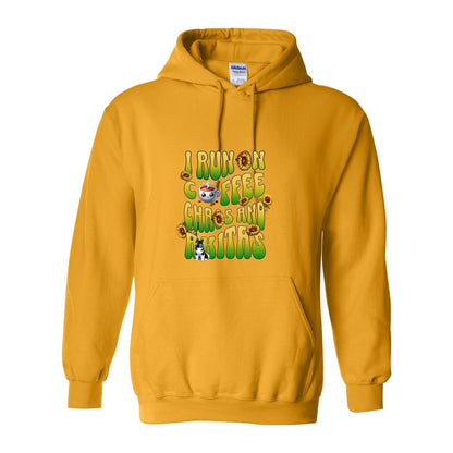 Yellow hooded sweatshirt with text 'I RUN ON COFFEE CHAOS AND Akitas' featuring colorful graphics.